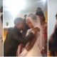 Na by force? Nigerians React as Unhappy Bride Dodges Groom's Lips, Refuses to Kiss Him in Viral Video
