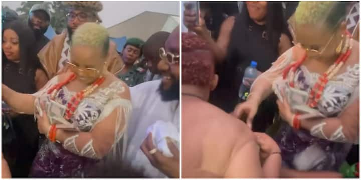 Thunder Fire Poverty: Reactions As E-Money’s Wife Sprays Kcee’s Woman With Bundles of Money on Dancefloor