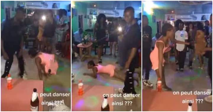 People stared in amazement as a Nigerian woman in a dress performed a snake-like dance in a club, throwing her legs up in the air