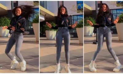 Slender Lady with Long Legs Dances in Front of Big Mansion, Twists Her Flexible Body Like Robot in Video