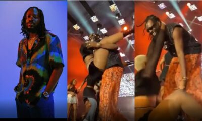 Embarrassing moment energetic dancer falls off Adekunle Gold’s body on stage(video)