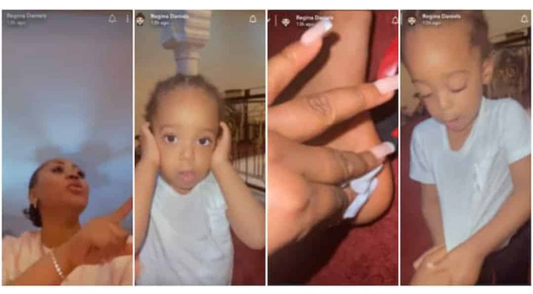“Sorry Mama I Won’t Do It Again”: Regina Daniels’ Son Holds His Ears, Apologises for Breaking Plate on Her Leg